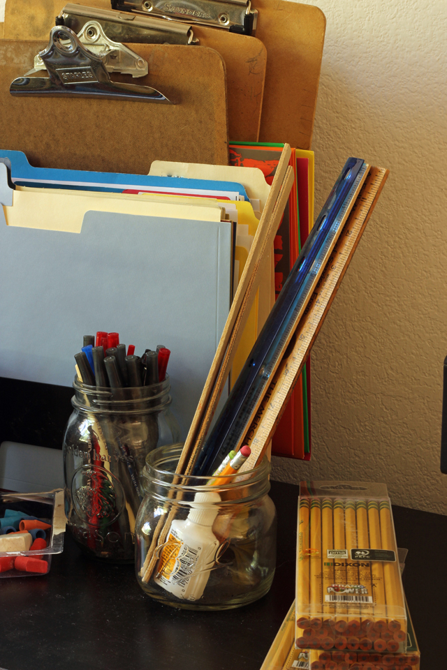 Clipboards and cum folders on table with pencils and riglers