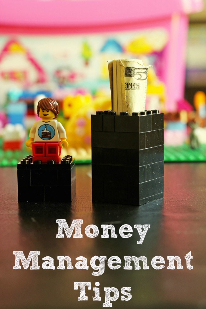 lego money holder with lid removed, rolled bills in the base with text overlay: Money management.