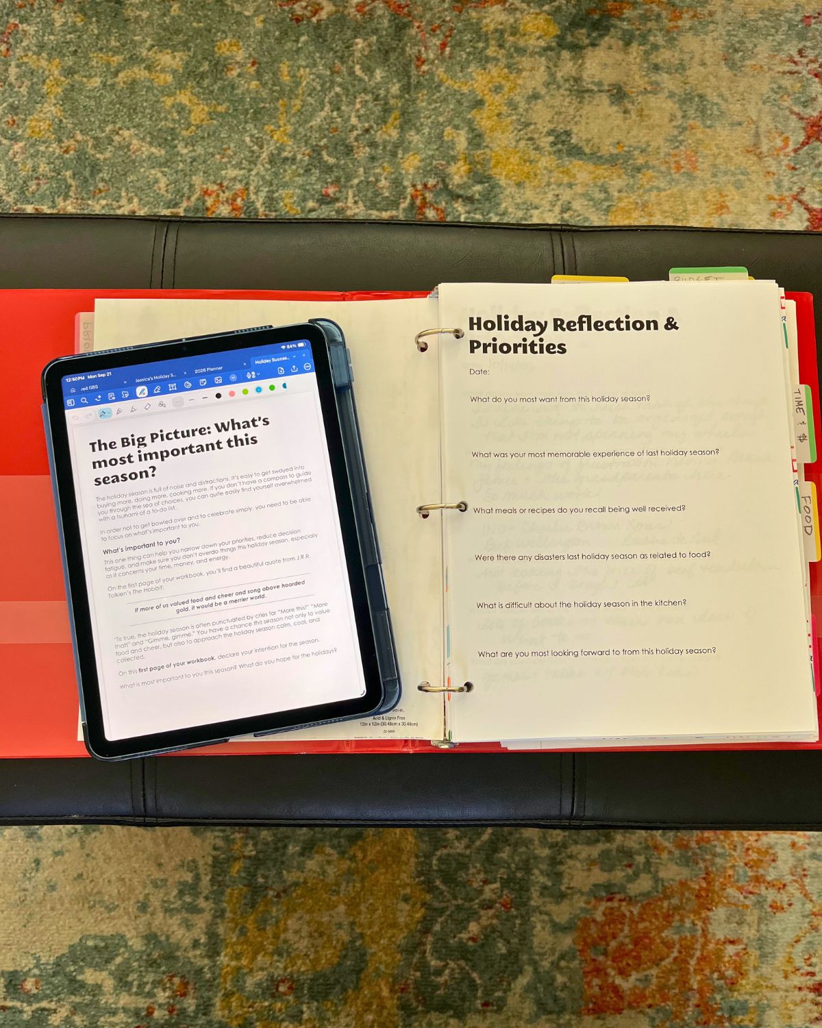 three ring binder with fresh workbook pages along with an iPad open to directions for how to use the pages.