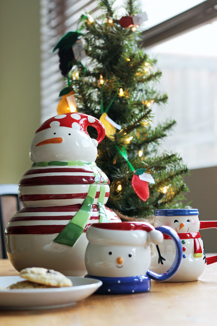 snowman cookie jar and mugs and cookie plate