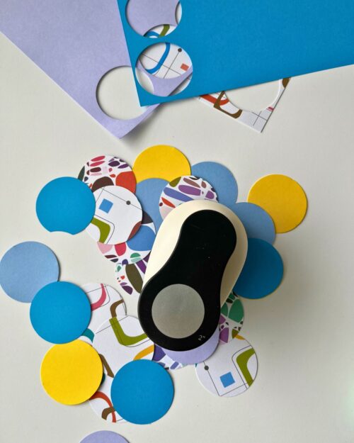 punching 2-inch circles out of colored paper.