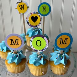 we love mom cupcakes on a cake stand.