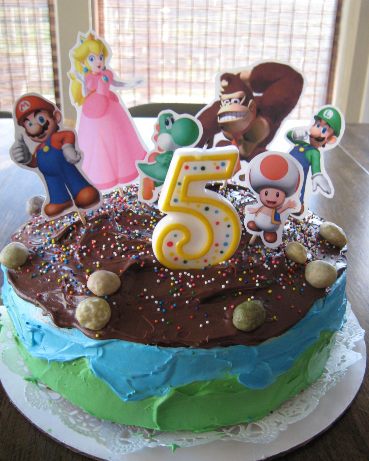 super mario cake with paper print outs.