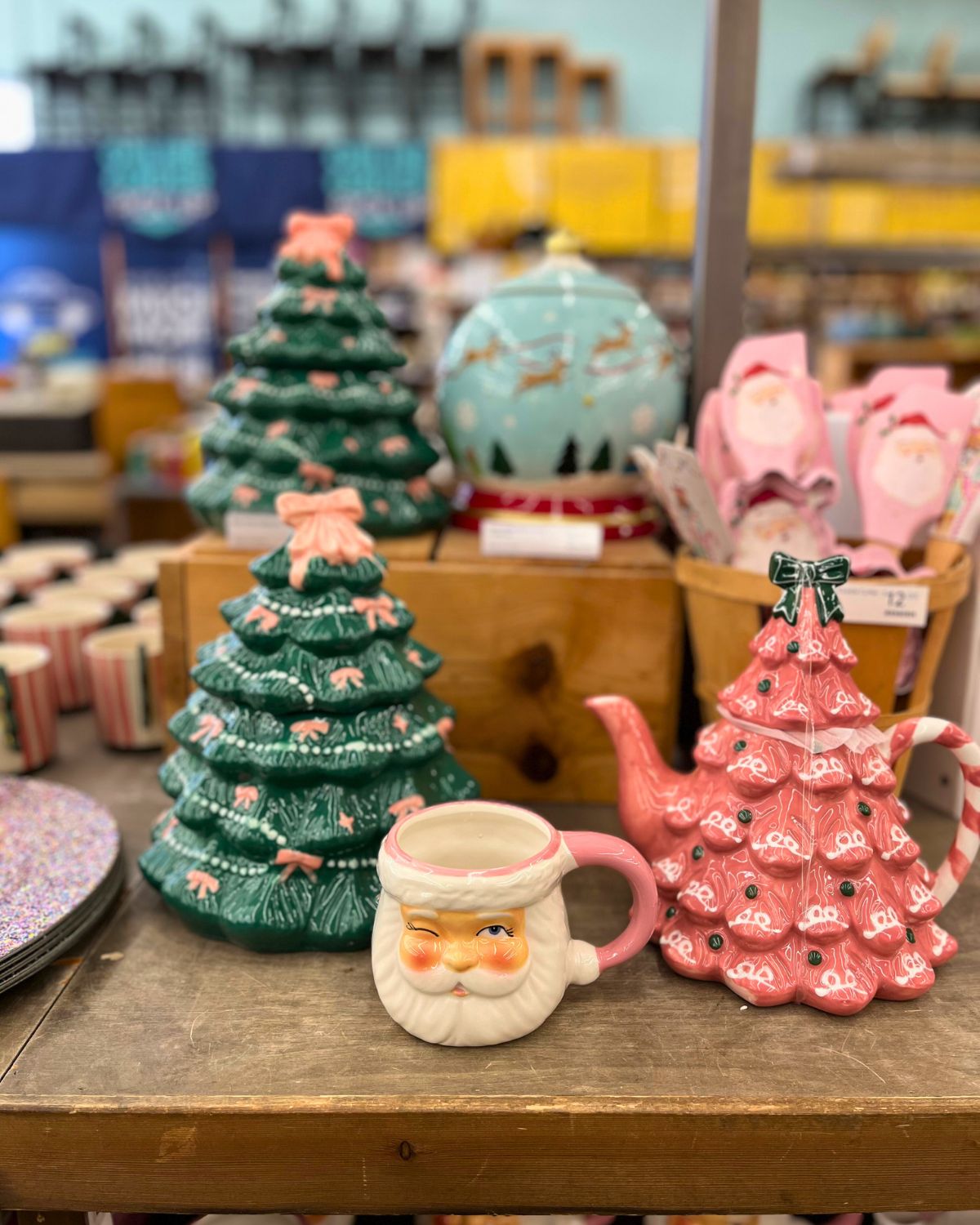 store display of christmas cookie jar, mug, and teapot.