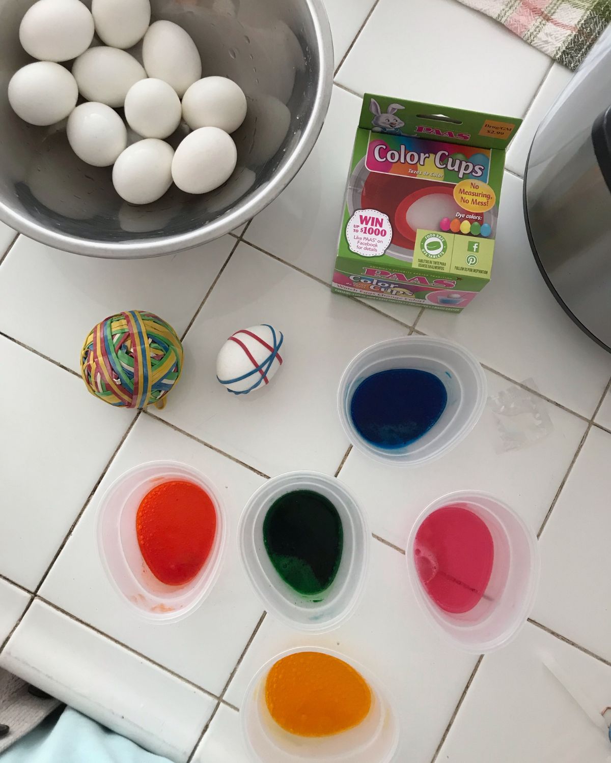 ingredients to dye easter eggs laid out on the counter.