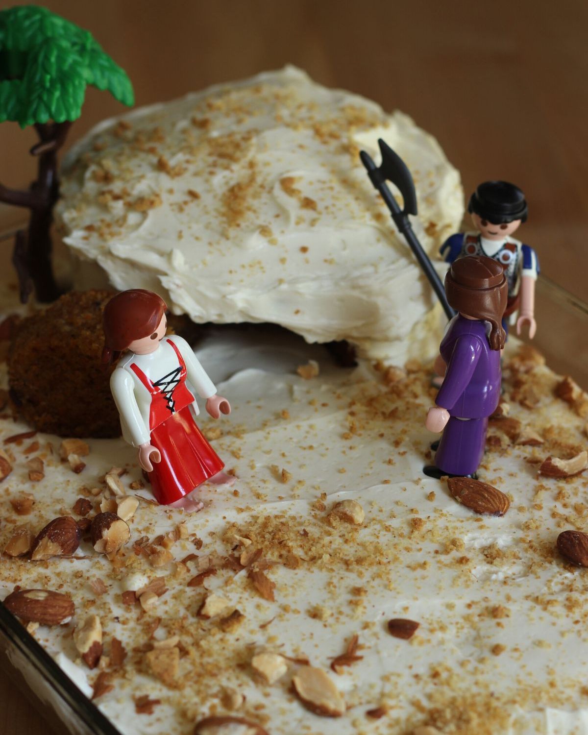 empty tomb cake with playmobil figures on the top.