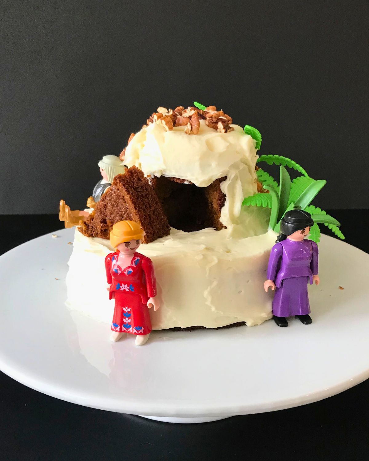 smaller version of an empty tomb cake with playmobil figures.