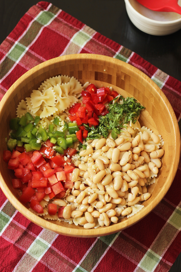 A bowl of bowtie pasta salad ingredients