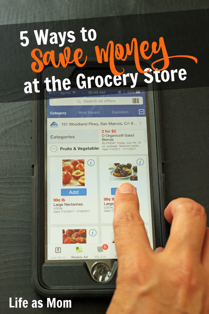 Hand touching screen of grocery app, with text overlay: Save Money at the Grocery Store.
