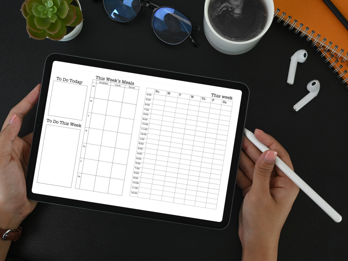 a woman holding an apple pencil and a a digital planner in an iPad, with desktop items nearby.