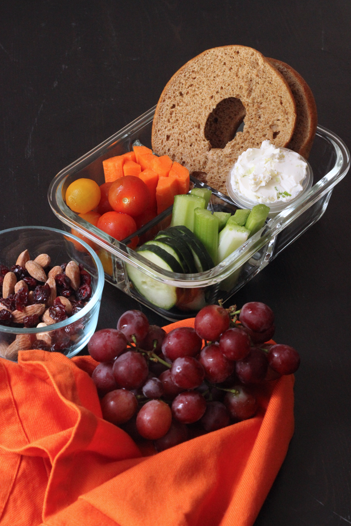 bagel boxed lunch with cluster of grapes on napkin