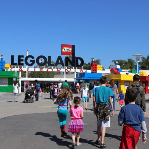 legoland entrance with sign and blue skies.