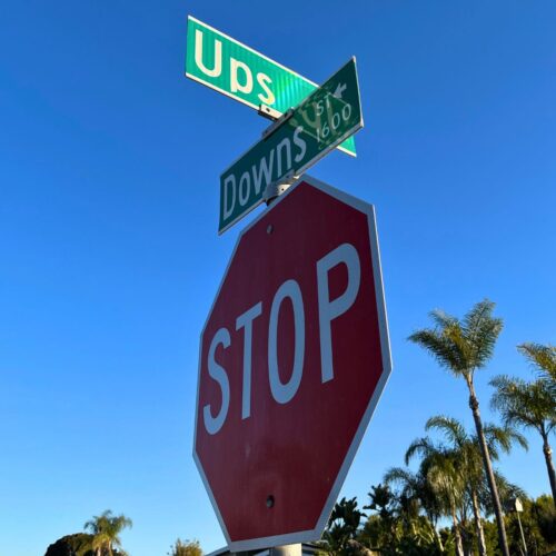 intersection signs at ups and downs streets.