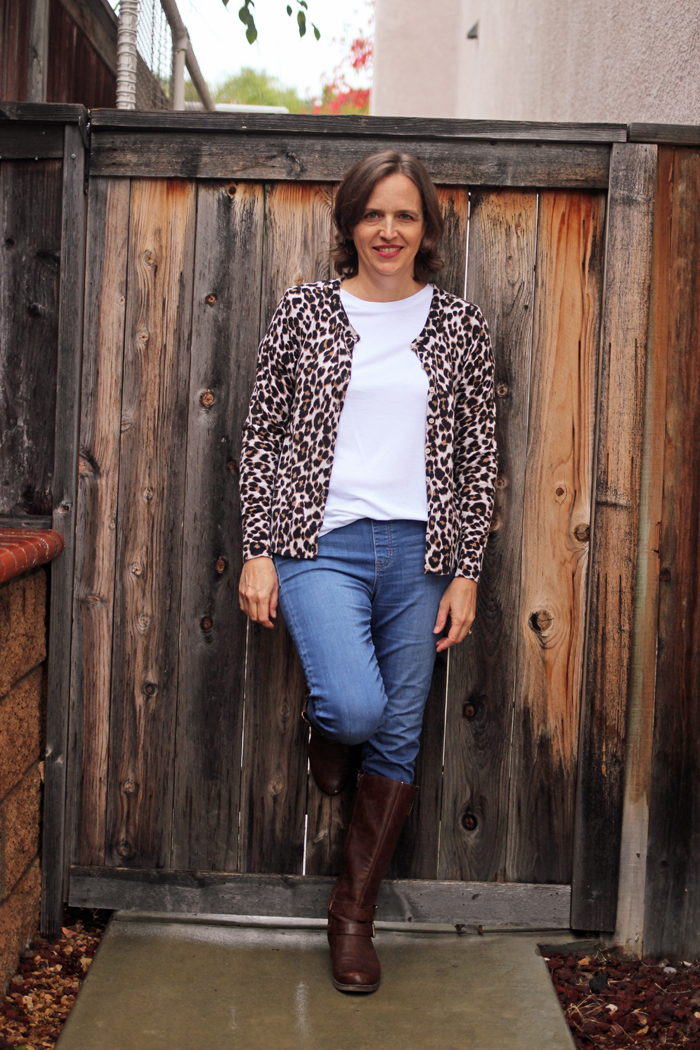 woman in jeans t-shirt and leopard cardigan