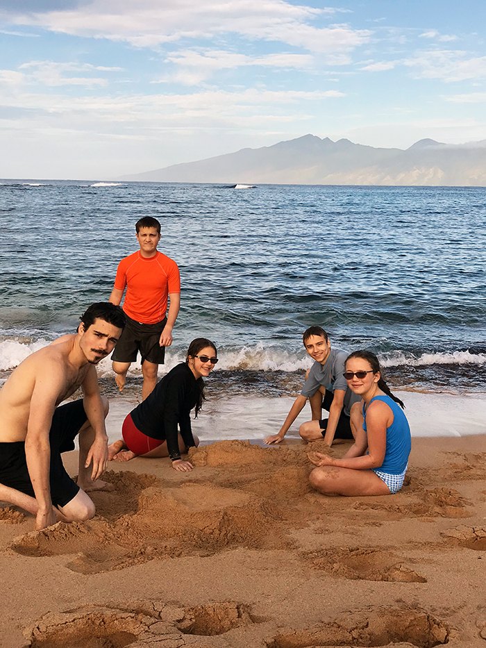 kids on beach playing in sand