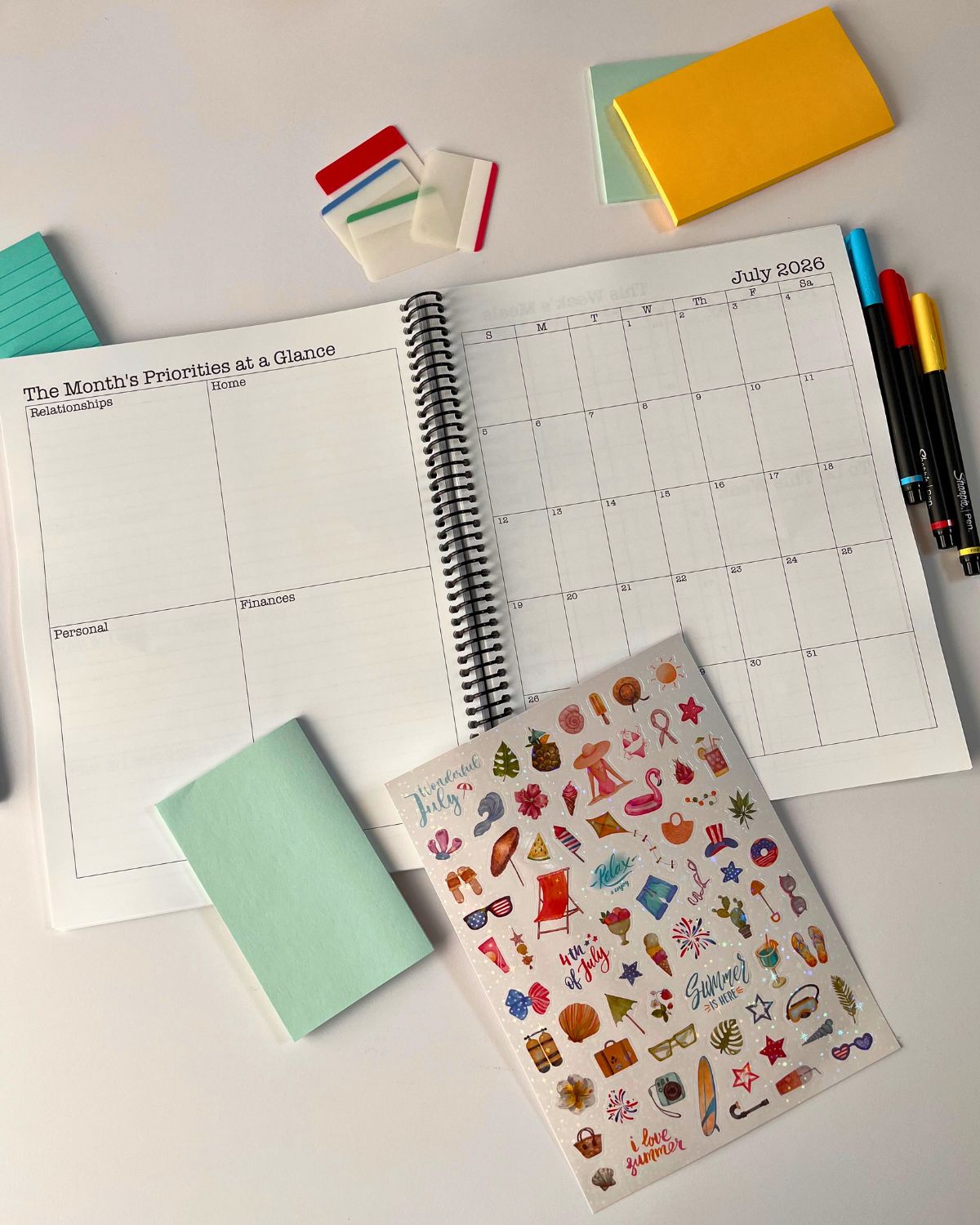 july 2-page spread open to monthly pages in planner.