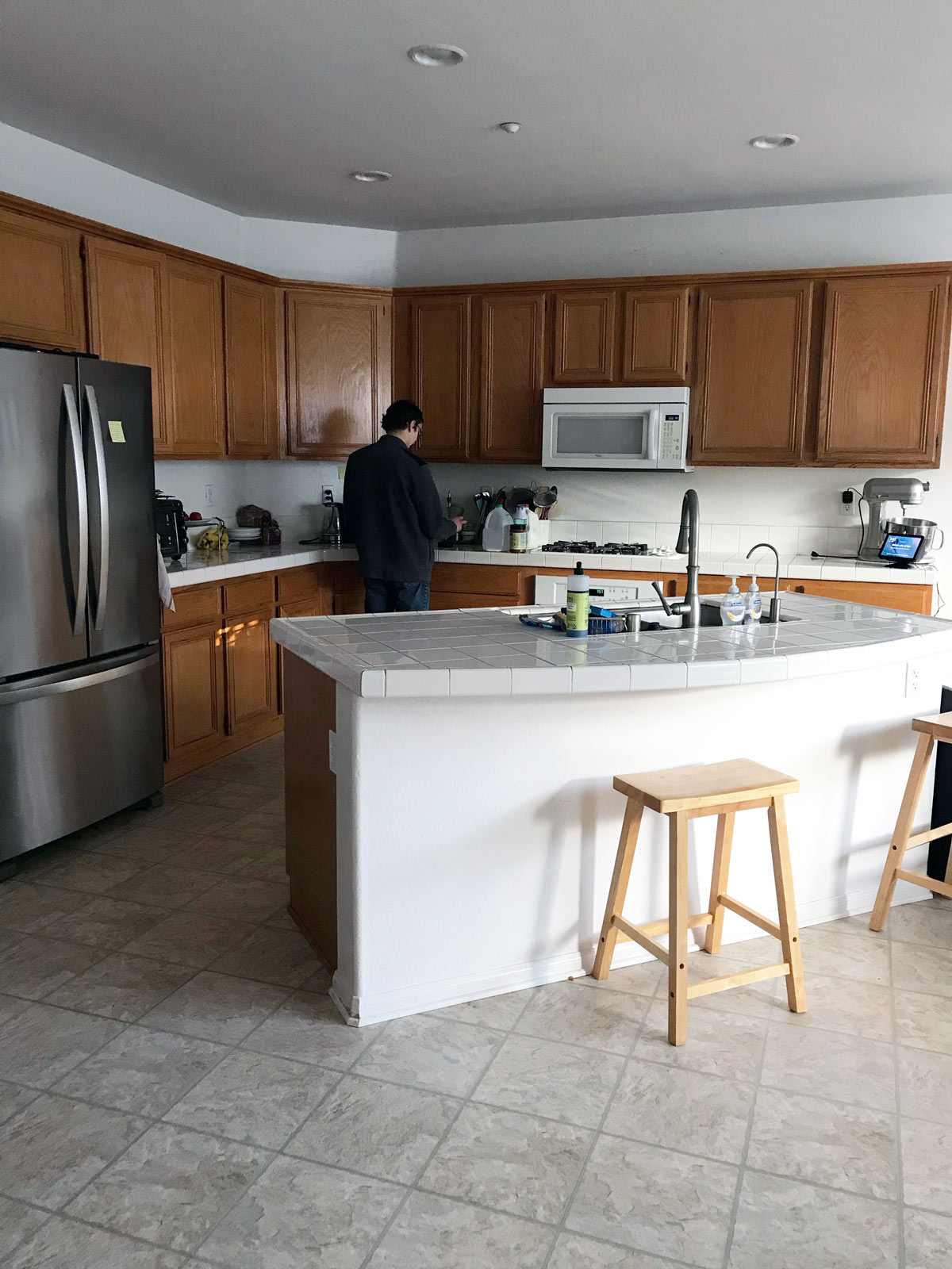 boy in clean kitchen making breakfast