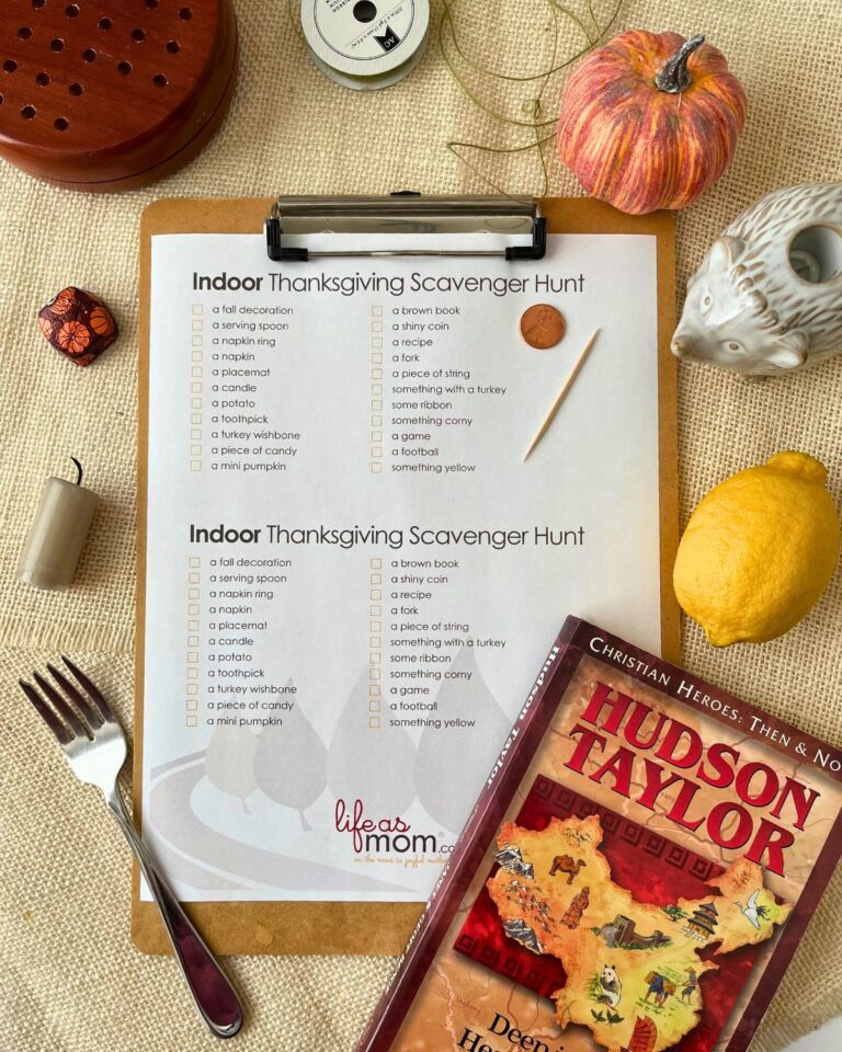 indoor scavenger hunt list on clipboard with items collected arrayed around it.