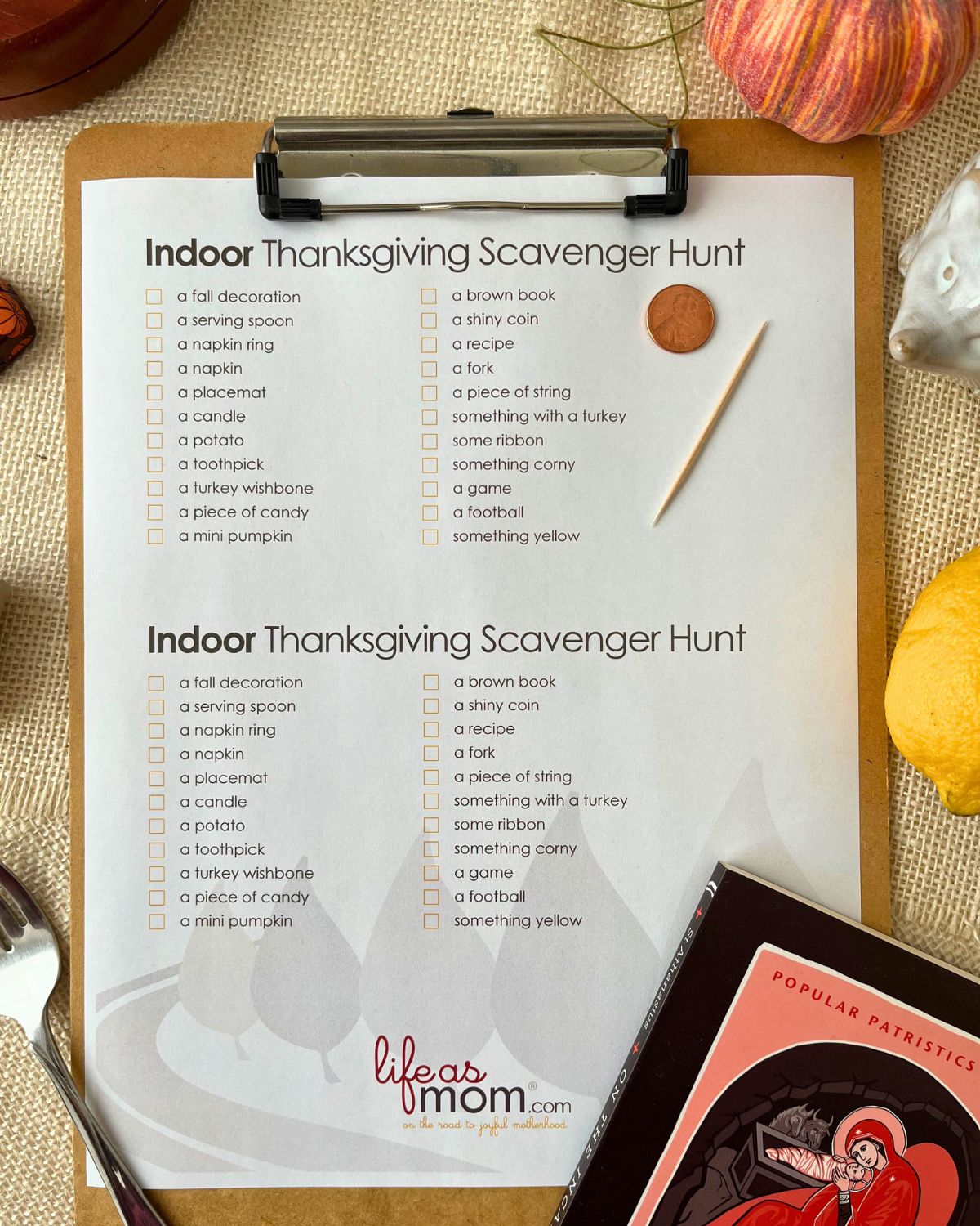 indoor scavenger hunt on clipboard with found items scattered around it.