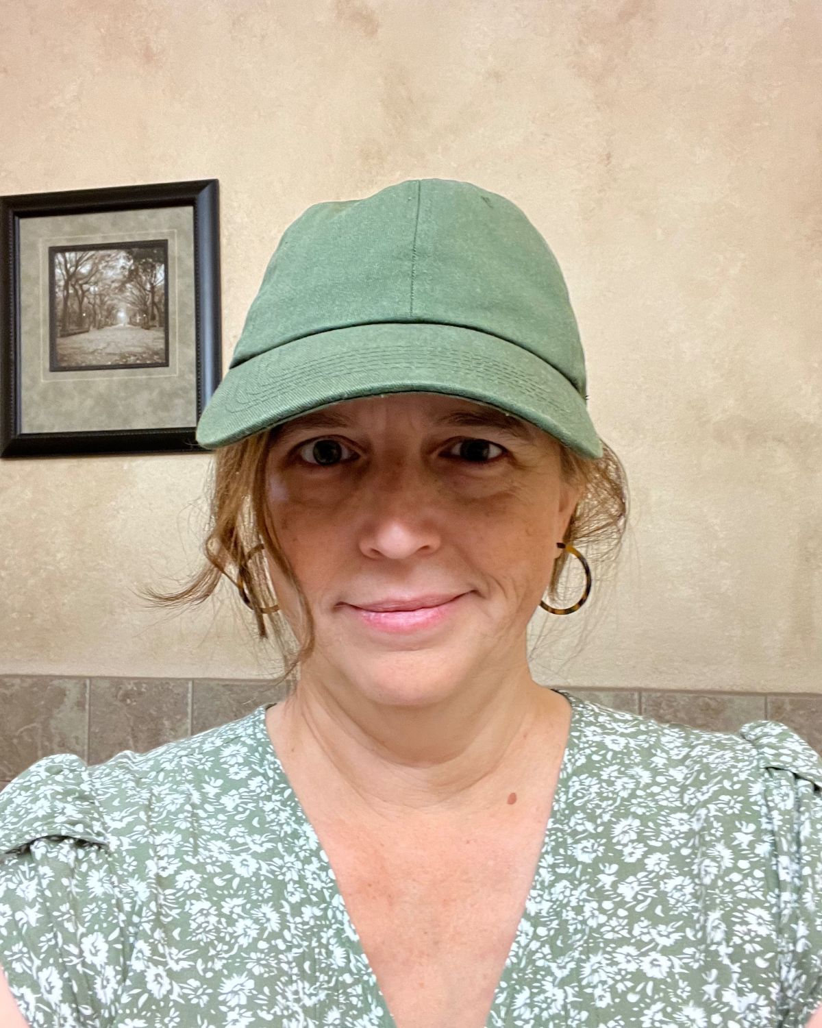 jessica wearing a green baseball cap.