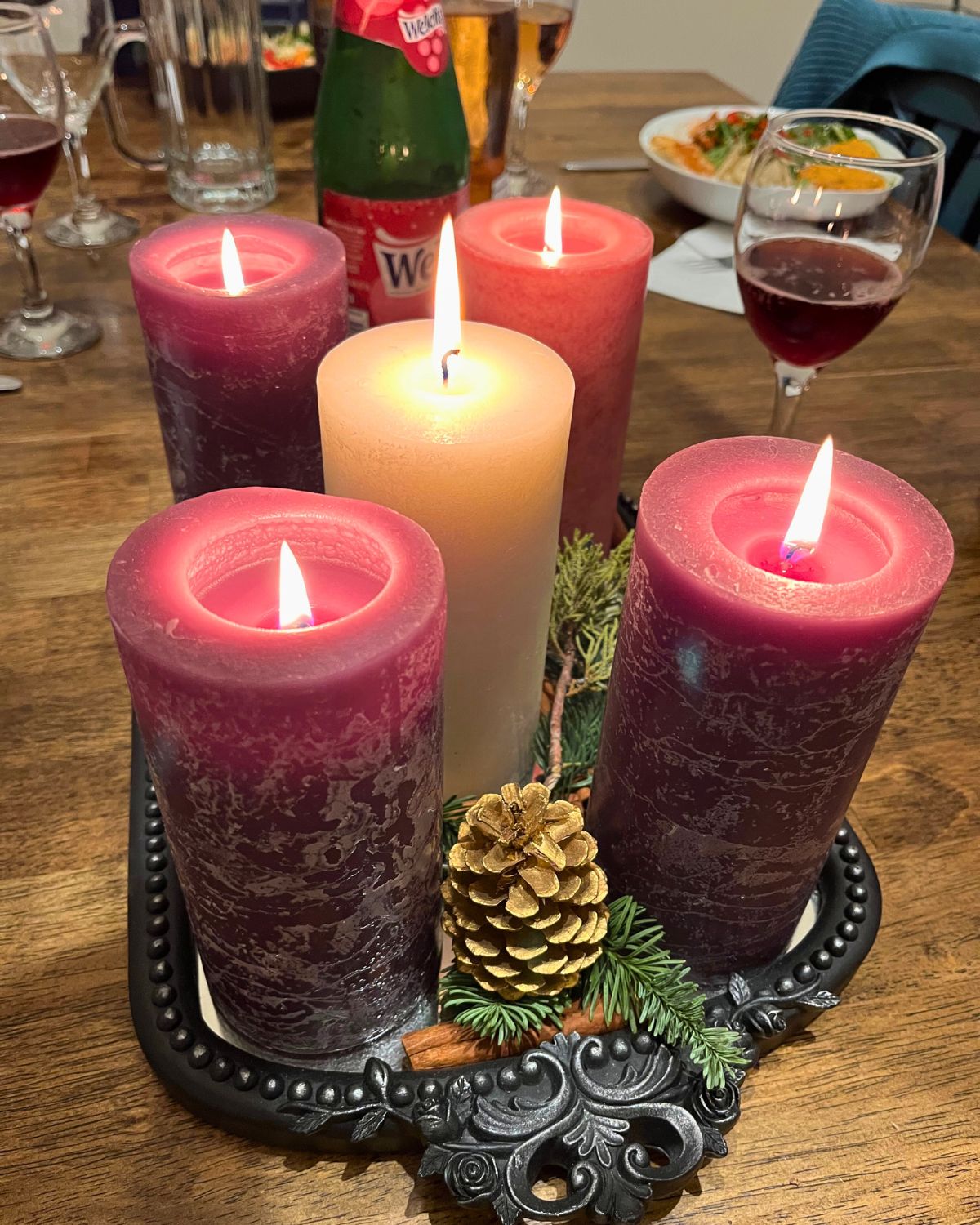 advent candles lit on christmas eve.