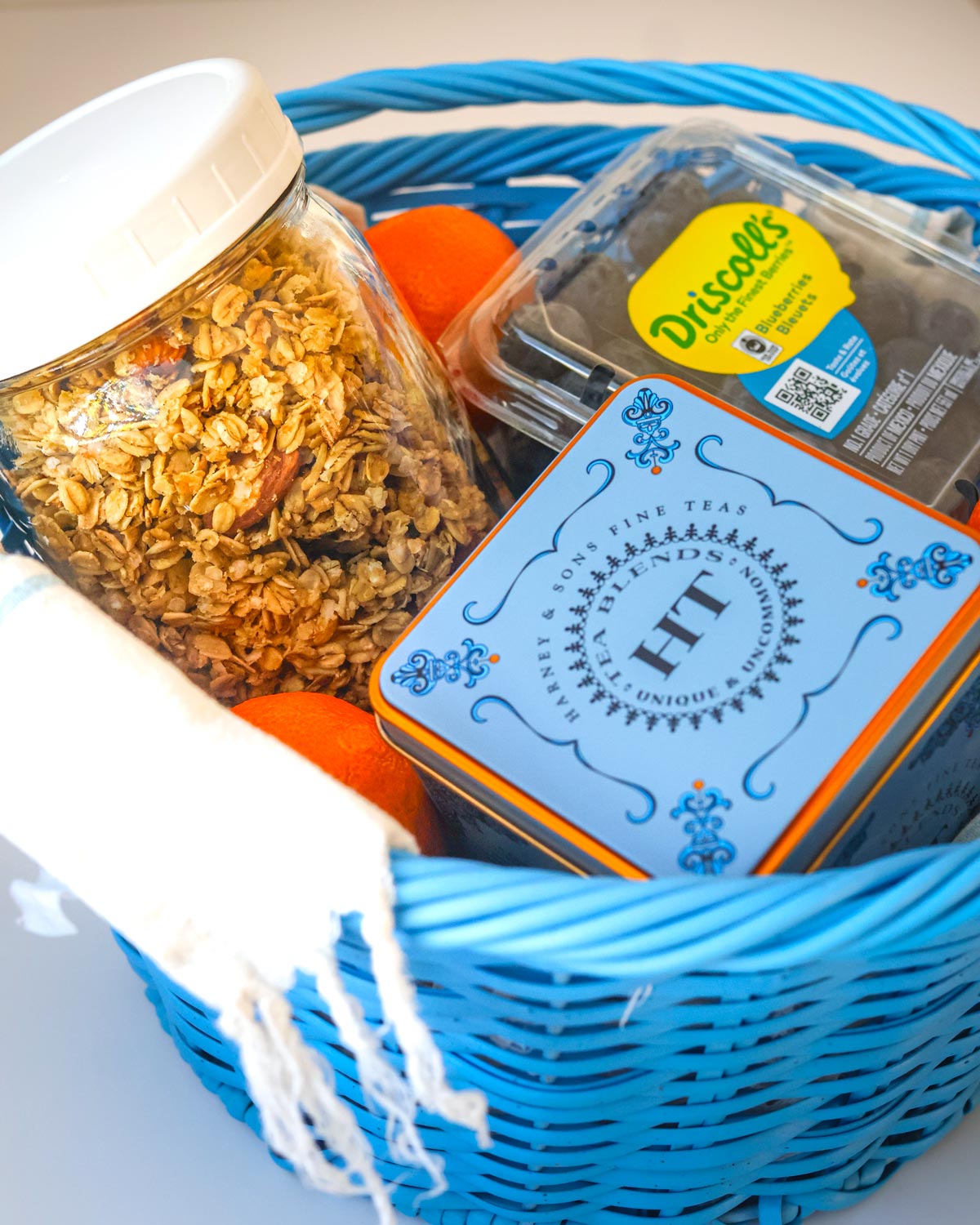 blue basket filled with breakfast items.