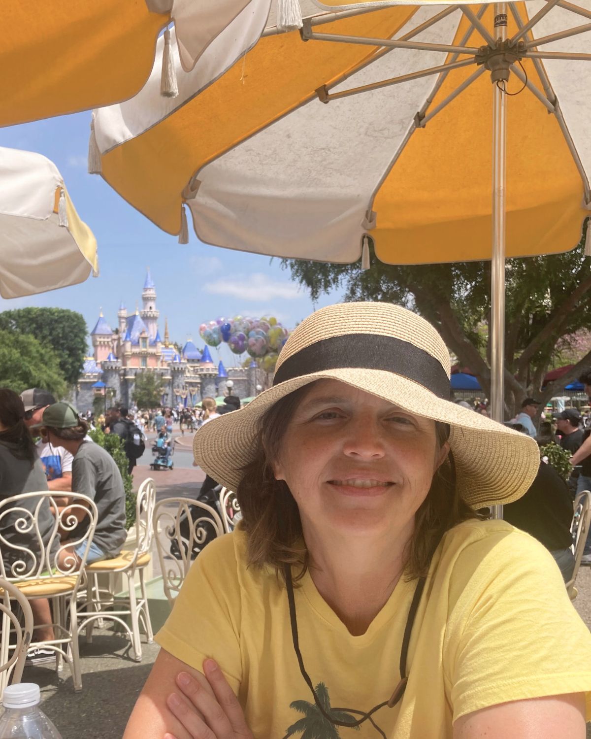 jessica at table with castle in background.