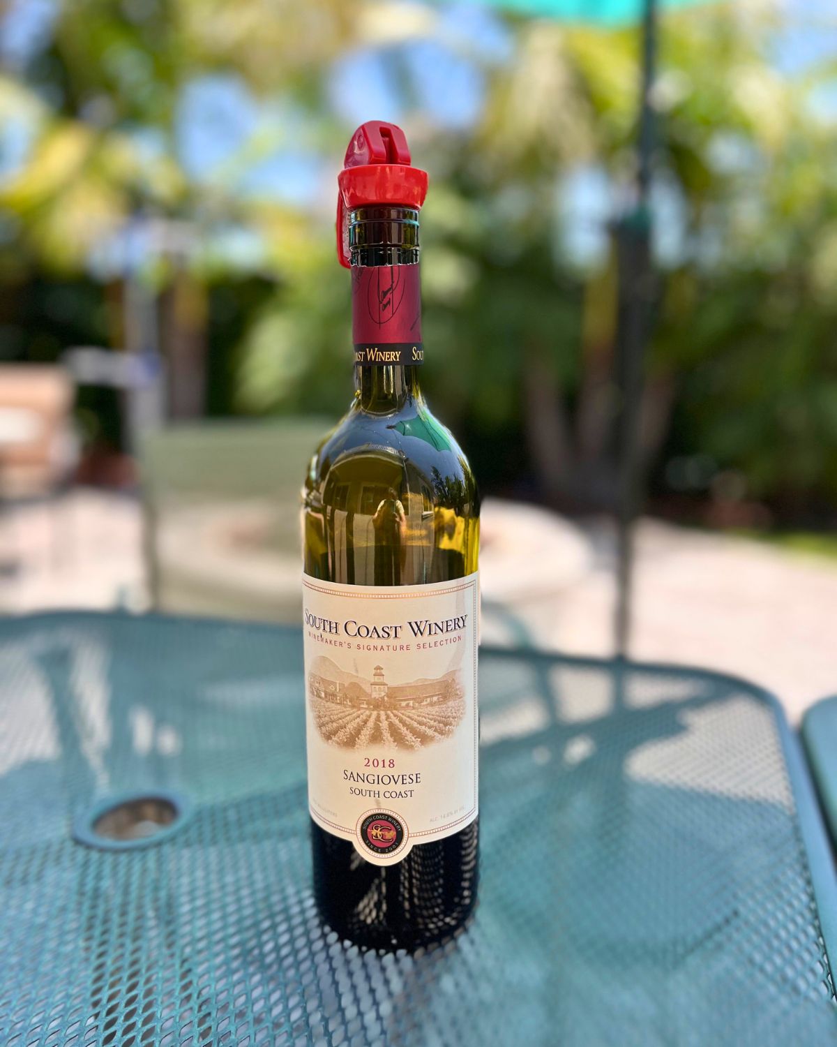 a bottle of wine on the back patio.