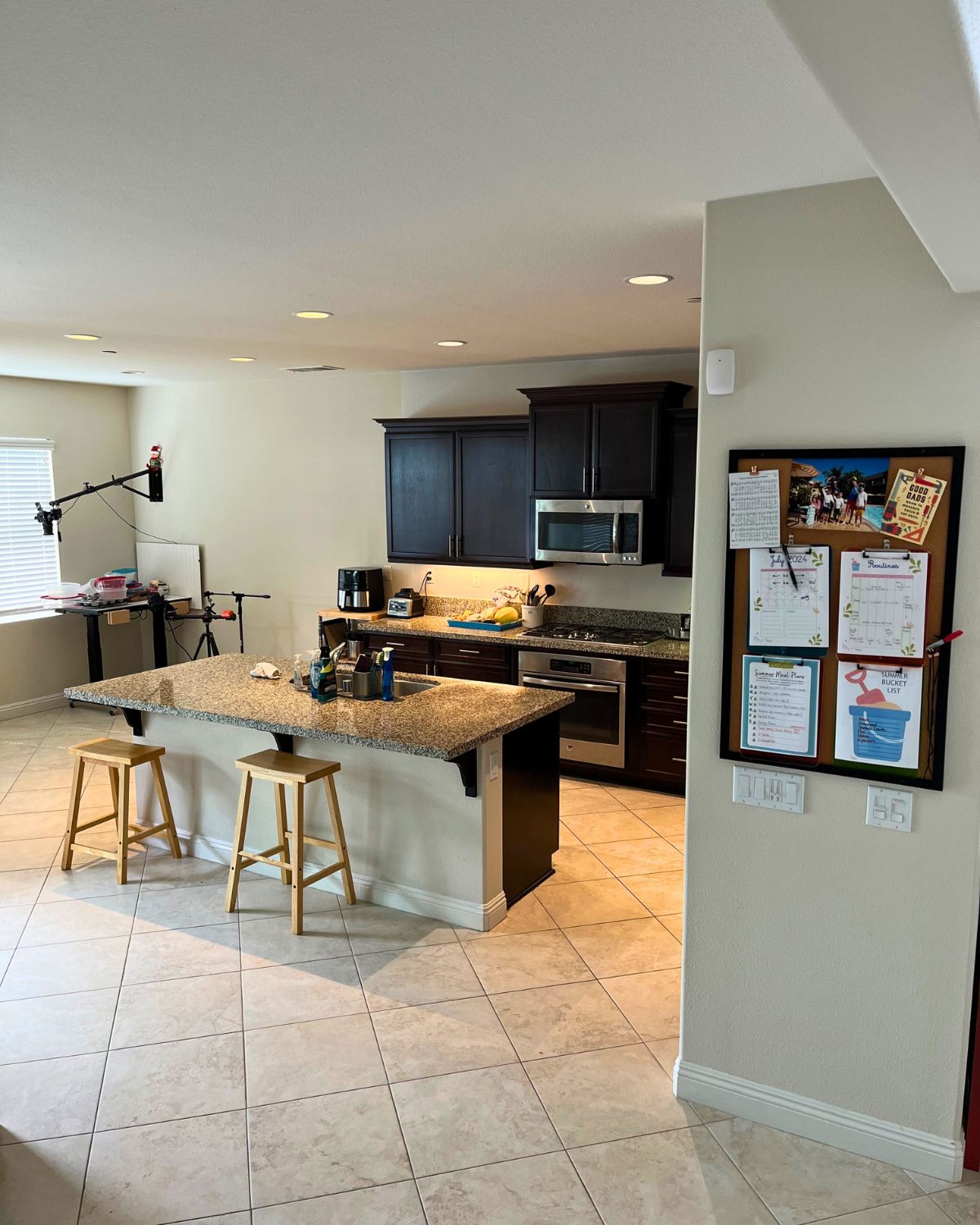 clean kitchen with lights on.
