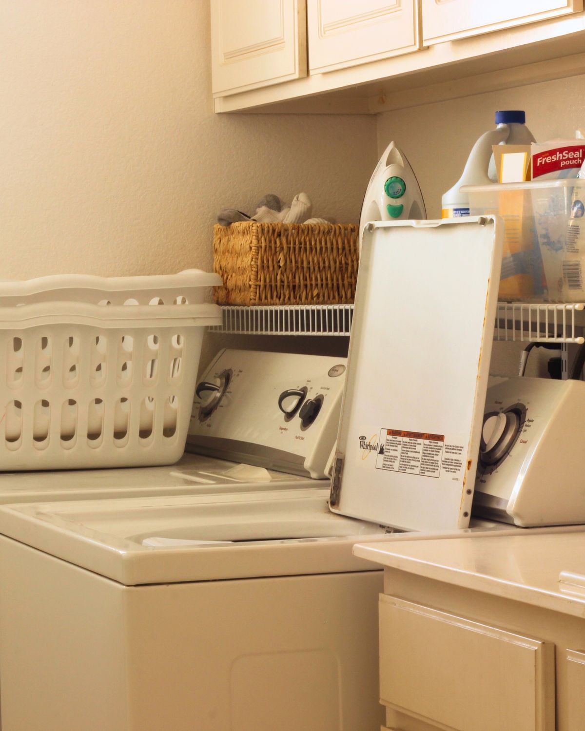 view of laundry room machines, with washer open.