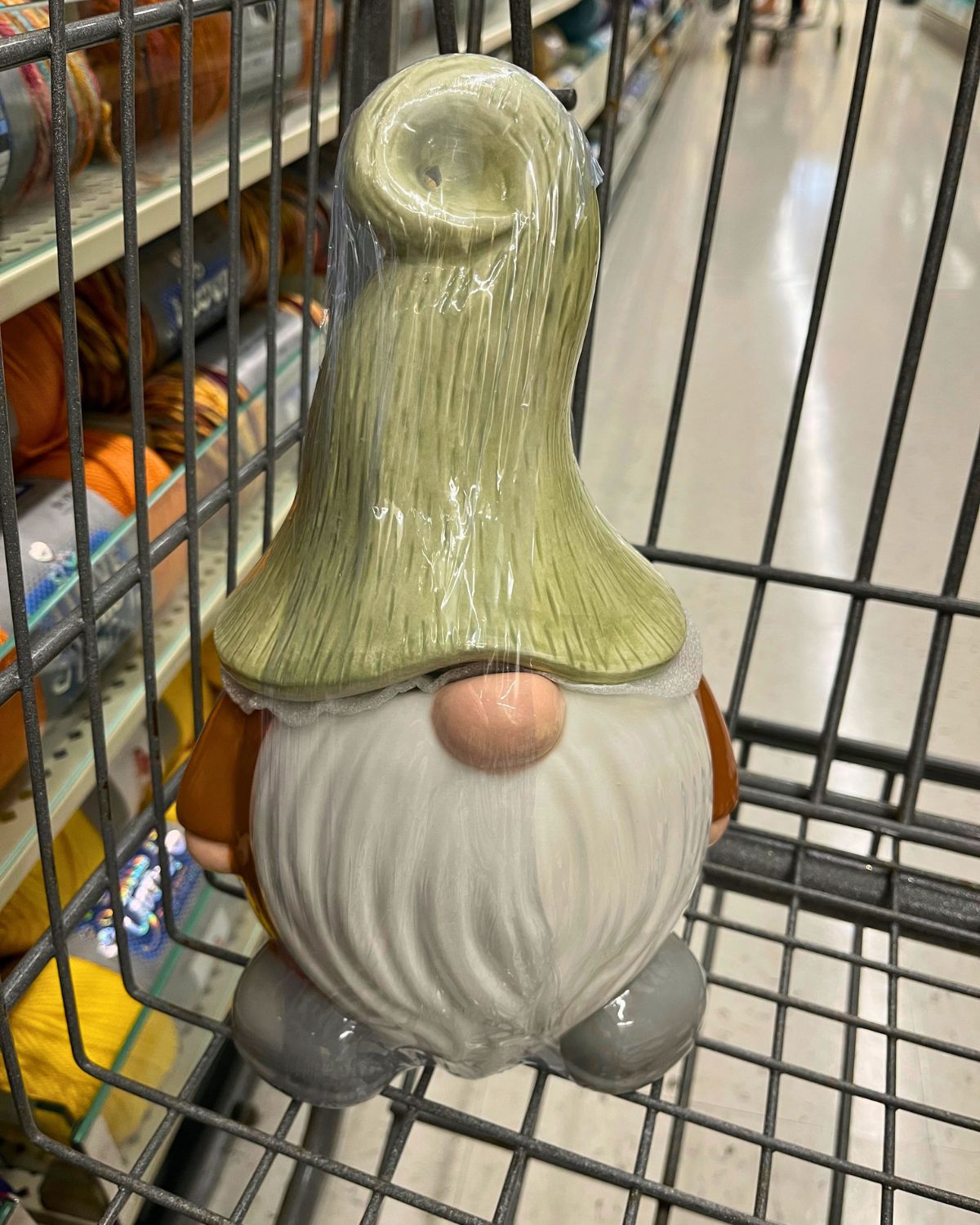 gnome cookie jar in shopping cart at hobby lobby.