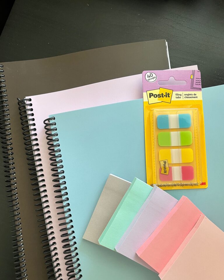 three printed planners with post-its.