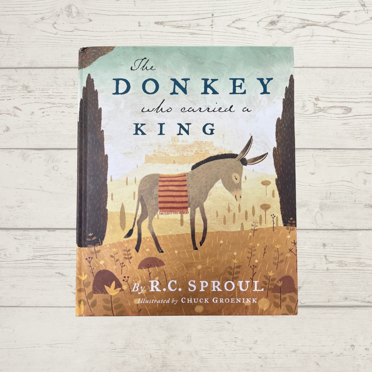the donkey who carried a king on wood background.