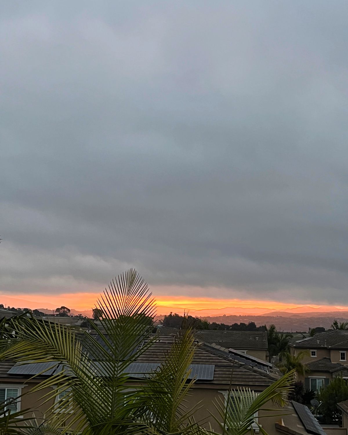 sunrise under a cloudy sky.
