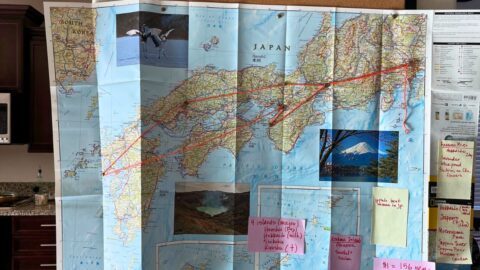 map of japan with orange yarn marking a path.