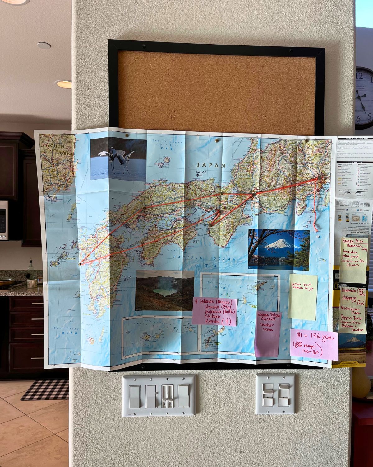 map of japan with orange yarn marking a path.