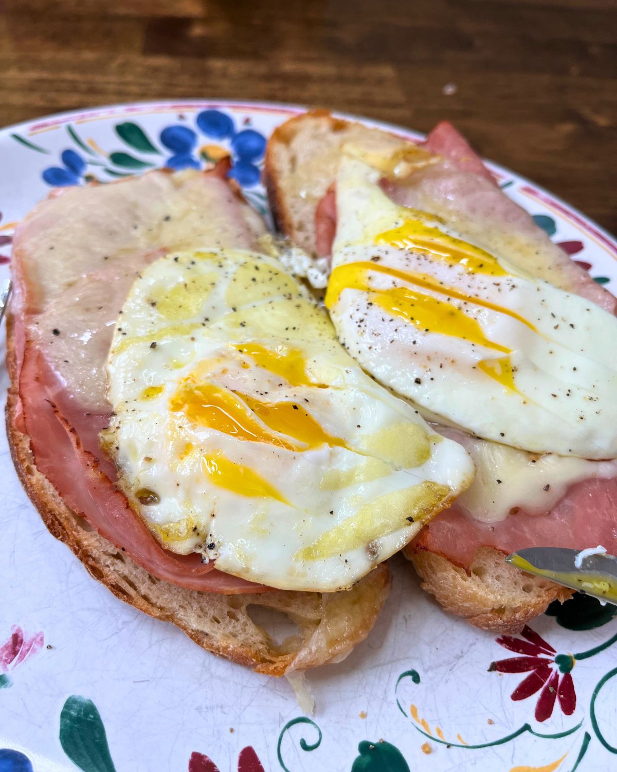 platter of ham, swiss, and fried egg toasts.