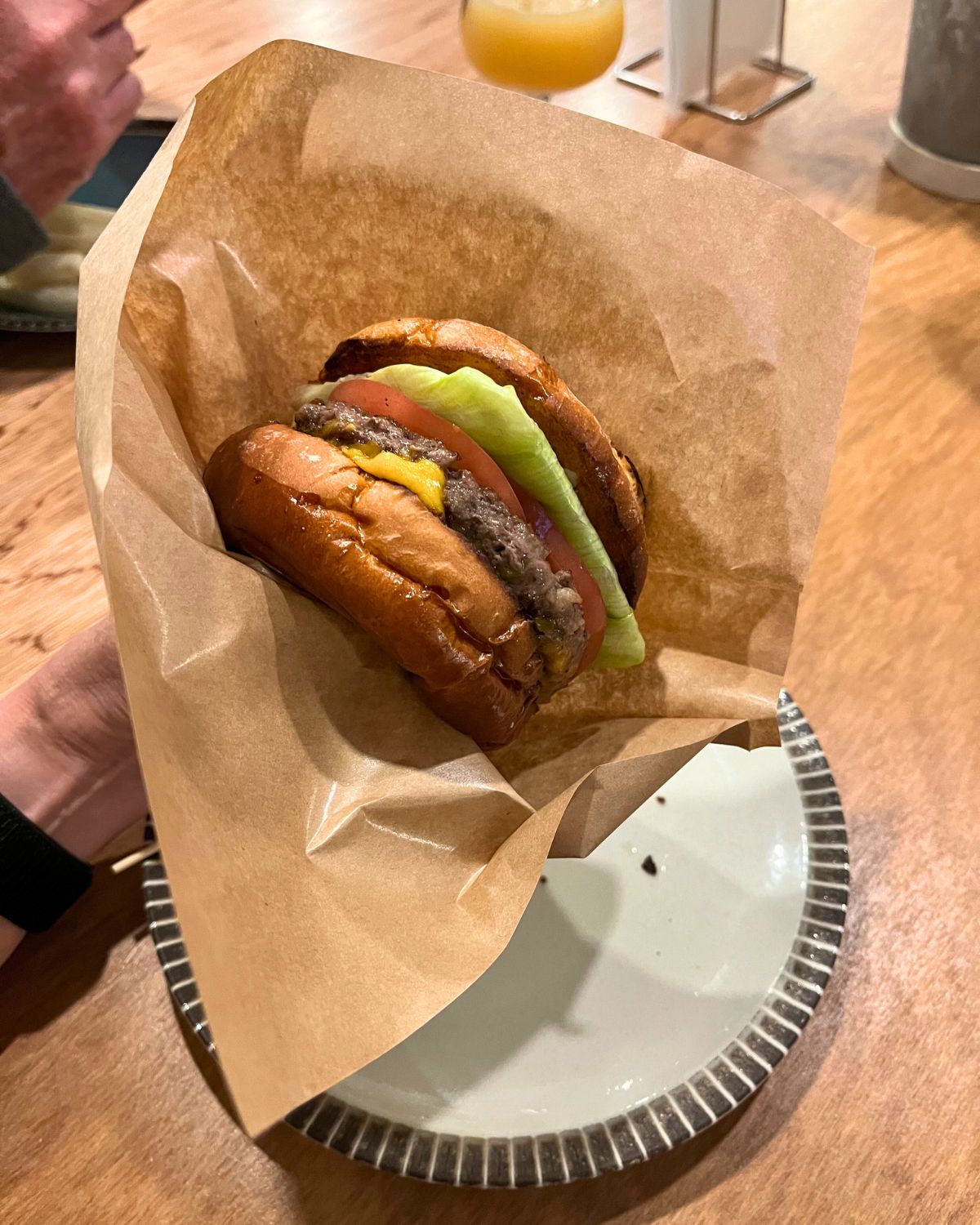 Japanese burger in paper burger bag.