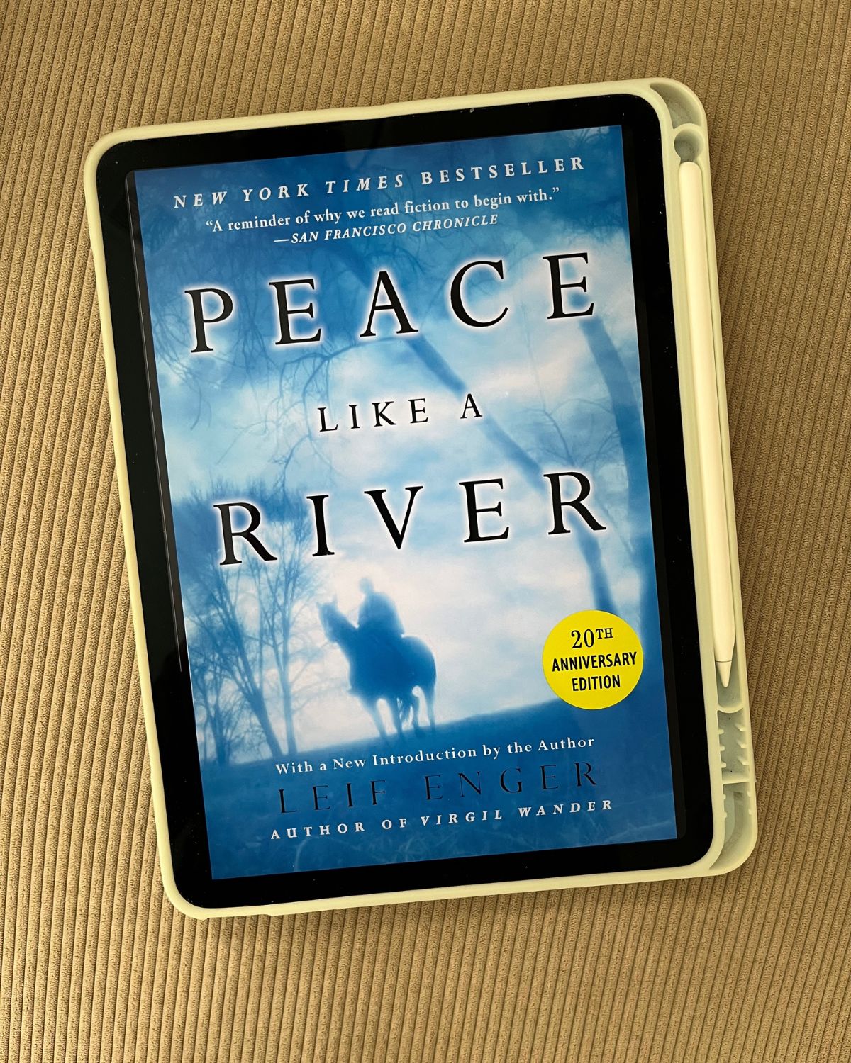 cover image of peace like a river on iPad on corduroy background.