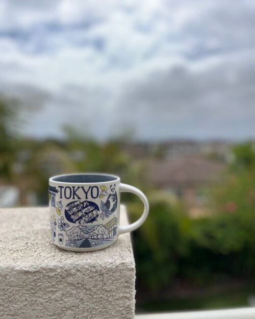 tokyo mug on pillar with the horizon in the distance.