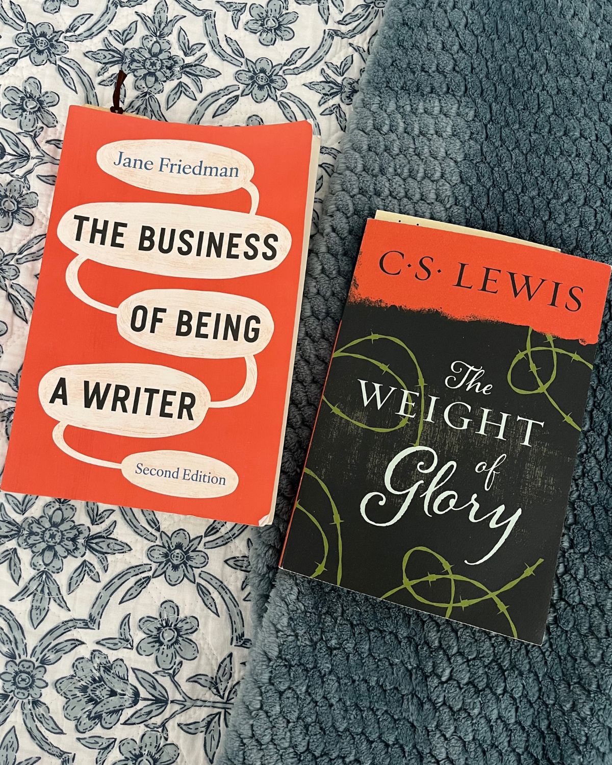 my current reads on the bed: jane friedman and cs lewis.