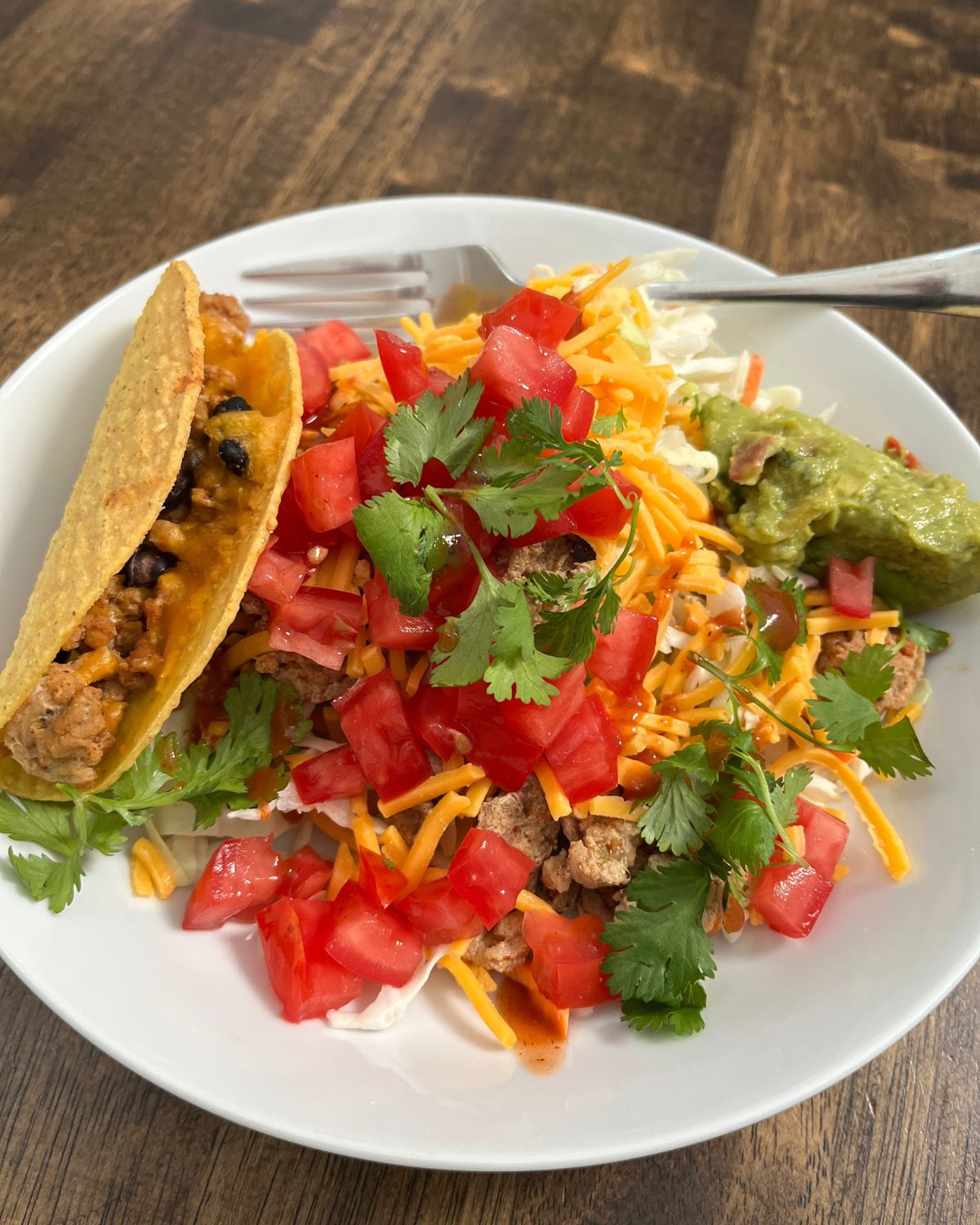 plate of taco salad and a baked taco.