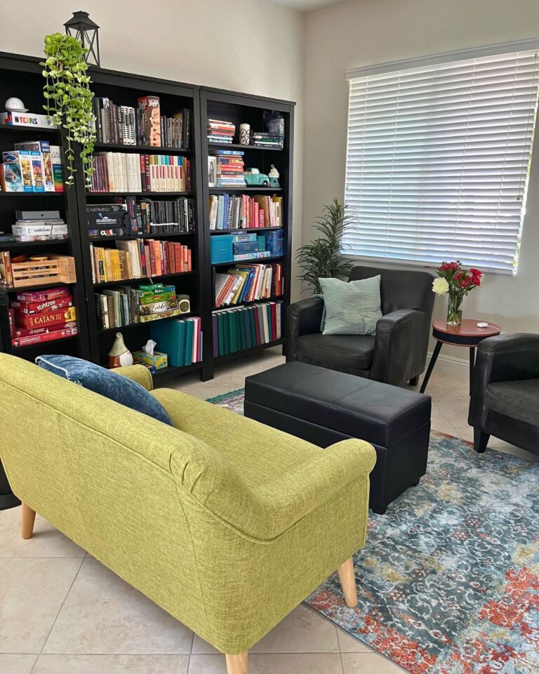 a view of the library with coach and chairs.