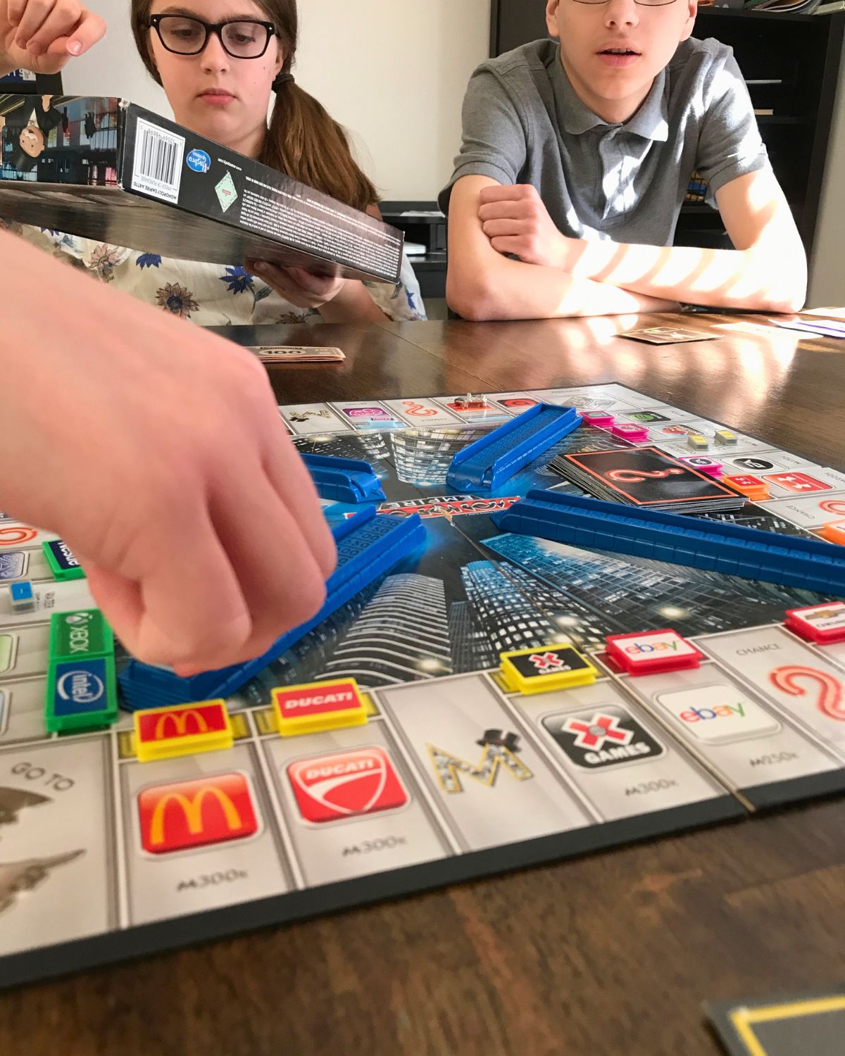 kids playing monopoly empire.