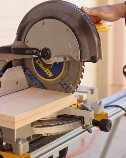 saw cutting planks into chunks.