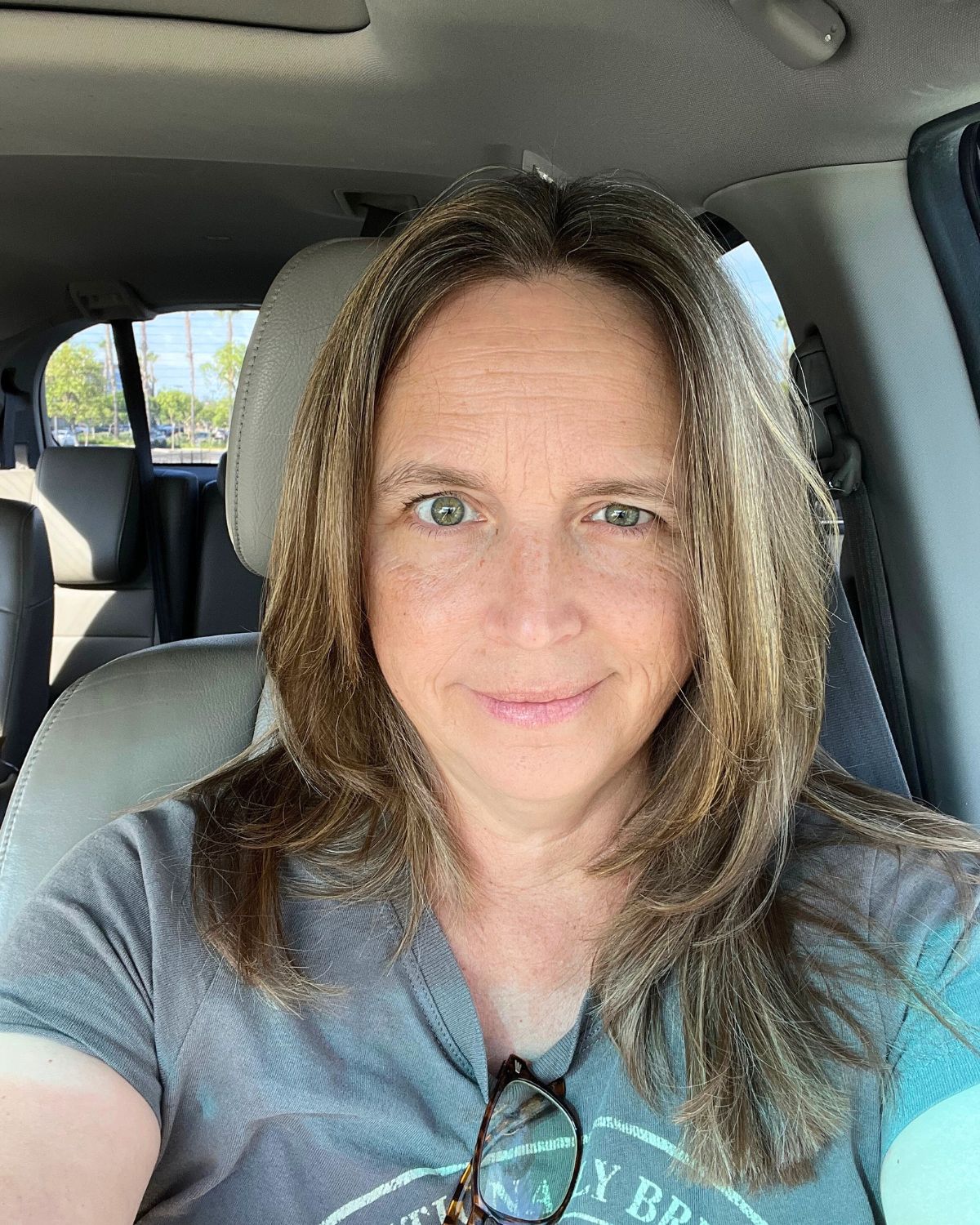 jessica looking at camera from car seat.