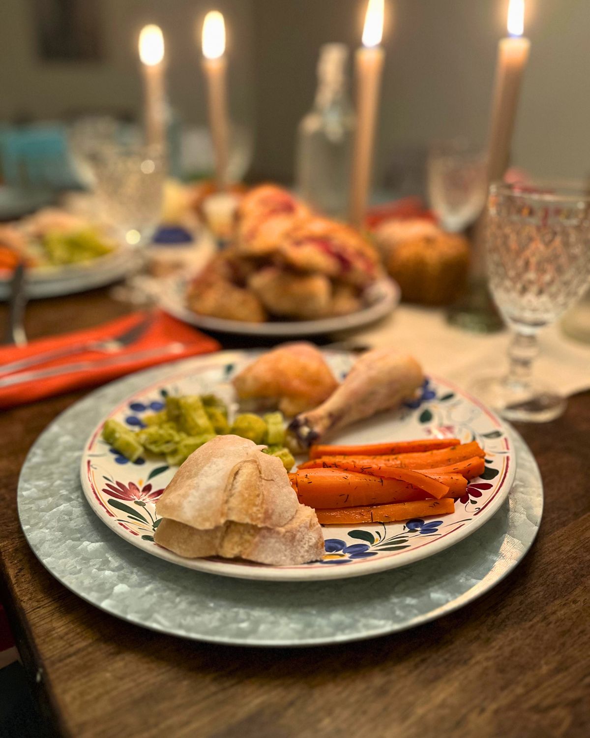 table scape of a fall sunday dinner with candles lit.