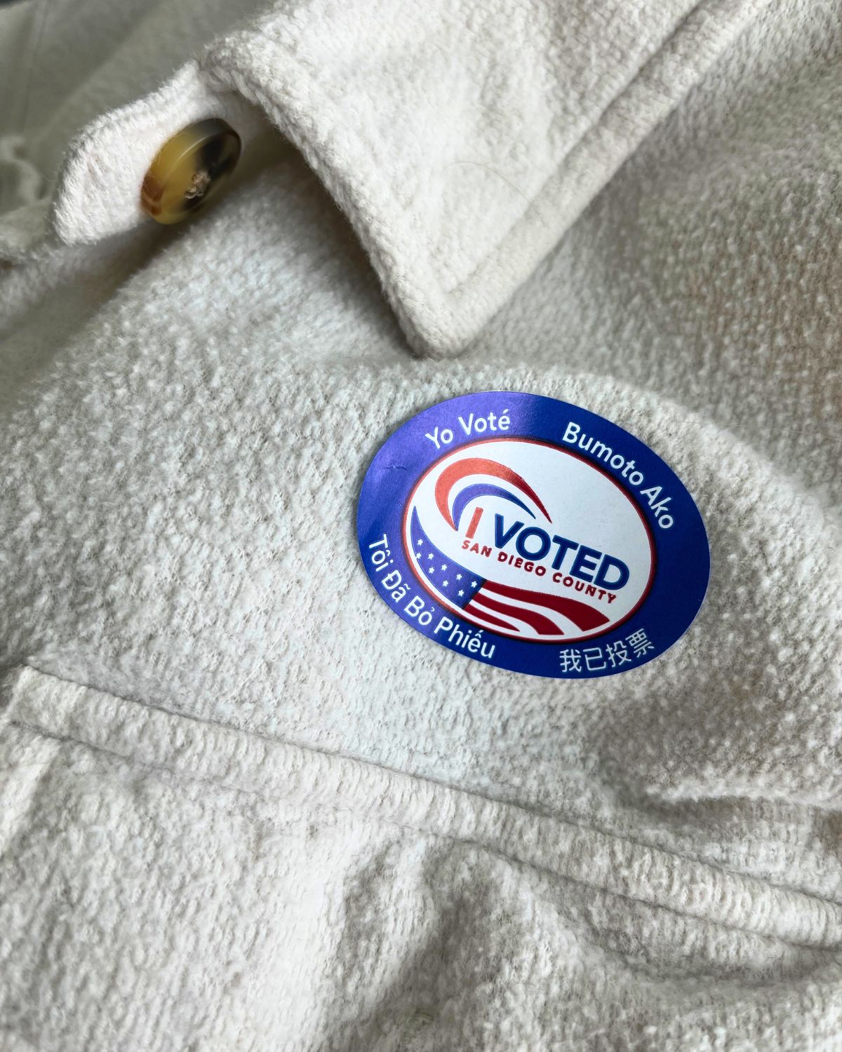 I voted sticker on lapel of jacket.