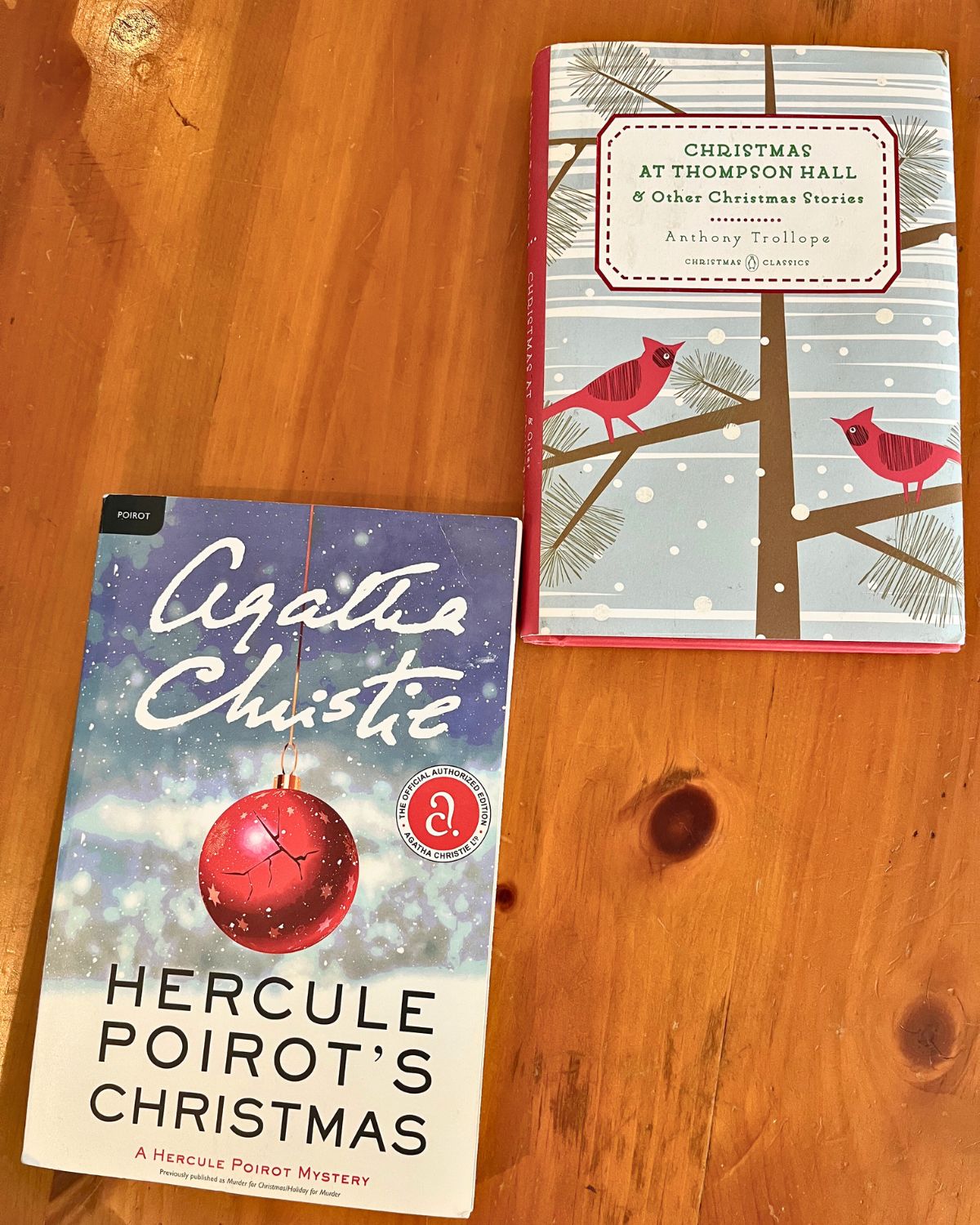 Christmas books on wood surface.