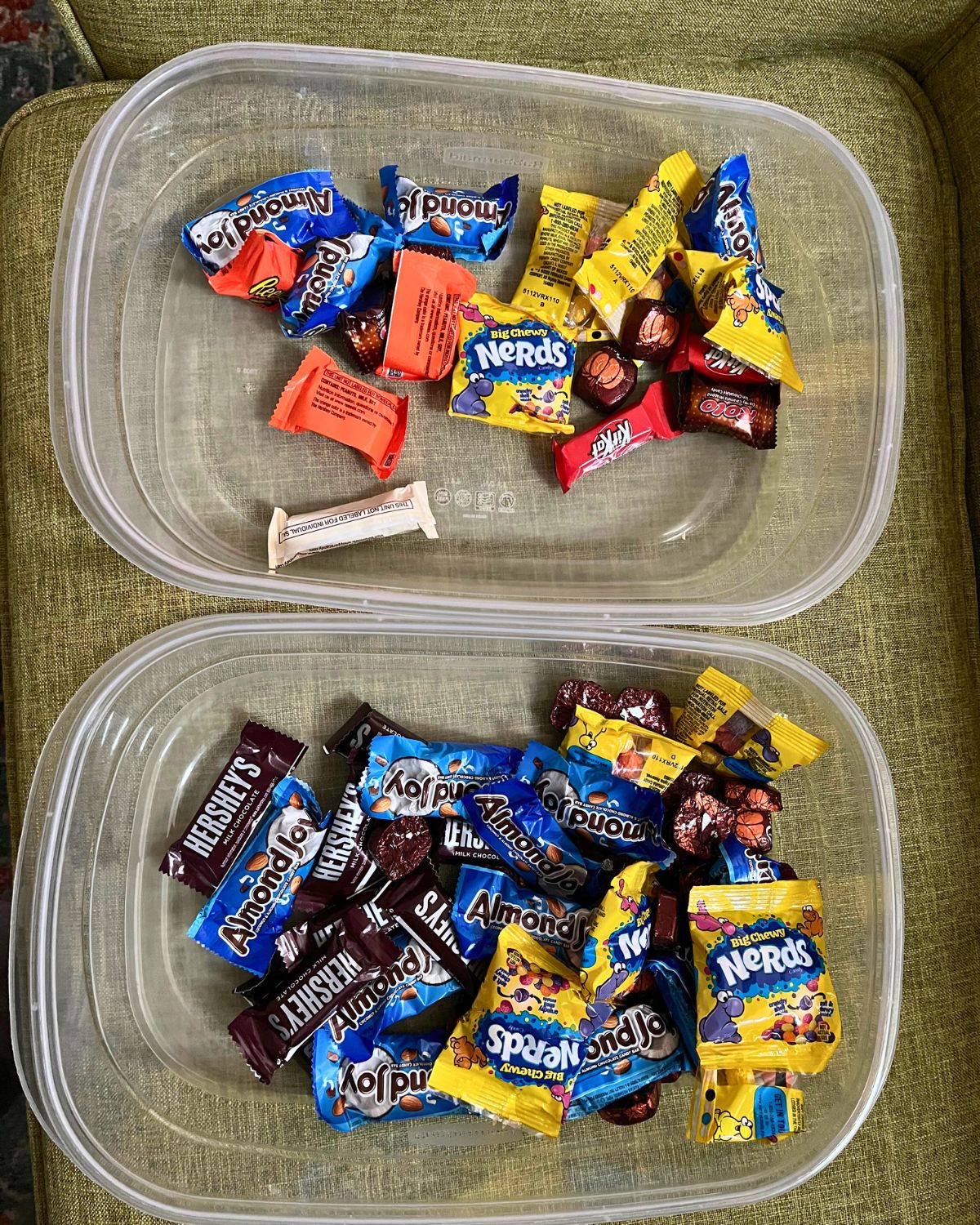 leftover halloween candy in plastic tubs.